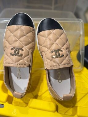 CHANEL Quilted Beige Leather Slip-On Flats with Black Cap Toe